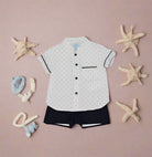 boys white mandarin collar shirt with shorts sleeves and blue shorts