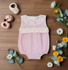 pink baby romper with floral print waistband and collar